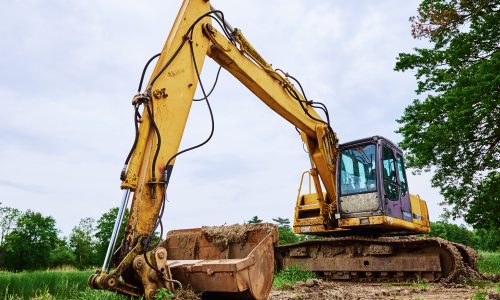Yellow excavator on construction site, Heavy construction machine excavating soil, Crawler backhoe working at dirt soil