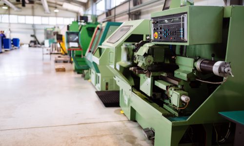 Industrial factory with cnc machines and workers