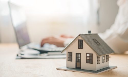 Salesperson Concept of holding house keys, house keys for a new home, new home purchase. a loan agreement for real estate, a loan deal for real estate, a loan agreement for real estate