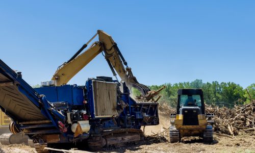 With the help an industrial shredder machine, we are shredding roots of roots on land being prepared for building housing developments