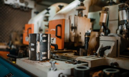 Woodworking machine closeup, lumber industry, carpentry. Wood processing on factory, forest sawing in lumberyard